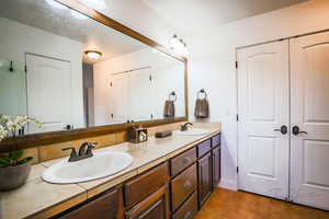 Bathroom with vanity and tile patterned floors