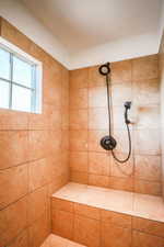 Bathroom featuring a tile shower