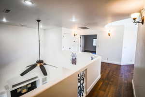 Hallway featuring dark hardwood / wood-style floors