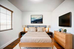 Bedroom featuring dark hardwood / wood-style floors