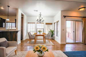 Dining room featuring an inviting chandelier, sink, and plenty of natural light