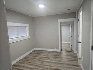 Spare room featuring light wood-type flooring