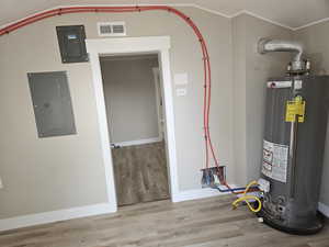 Utility room featuring gas water heater