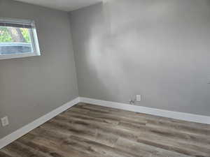 Unfurnished room featuring wood-type flooring