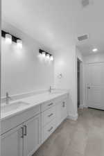 Bathroom featuring vanity and tile patterned floors