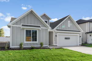 View of front facade with a garage and a front yard