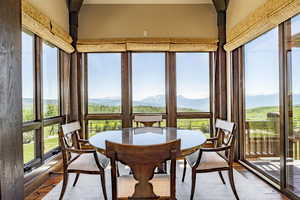 Sunroom / solarium with a mountain view