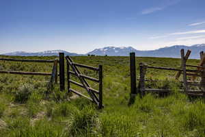 View of gate featuring a mountain view and a rural view