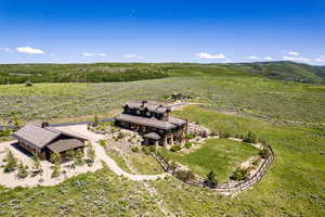 Birds eye view of property with a rural view