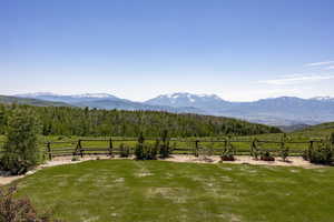 Property view of mountains with a rural view