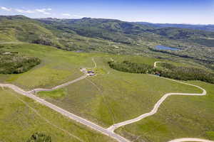 Bird's eye view featuring a water and mountain view