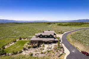 Drone / aerial view with a mountain view and a rural view