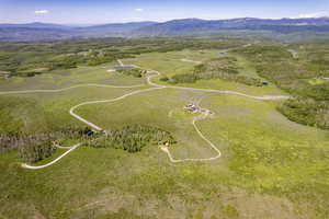 Birds eye view of property with a mountain view