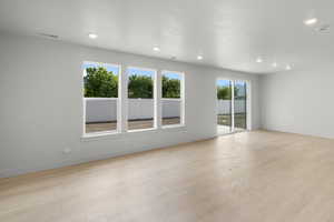 Spare room with light wood-type flooring