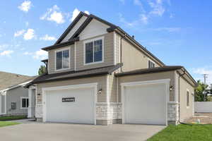 Craftsman-style home featuring a garage