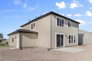 Rear view of house with a patio