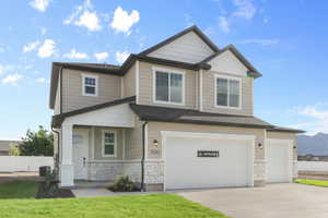 Craftsman-style home featuring central AC and a garage