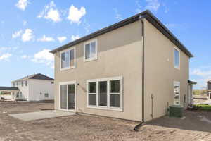 Back of house featuring a patio area and central air condition unit