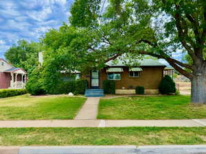 View of front of property with a front yard