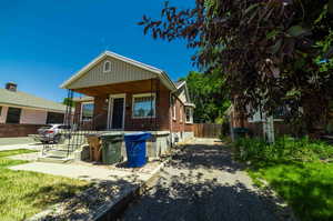 Rear view of house with covered porch