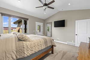 Master bedroom with vaulted ceiling and fan