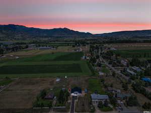 Aerial view at dusk featuring a mountain view