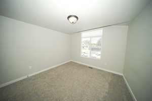 Unfurnished room featuring carpet floors