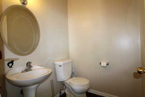 Bathroom featuring sink and toilet