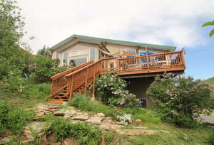 View of property with a wooden deck - Call for a showing today!