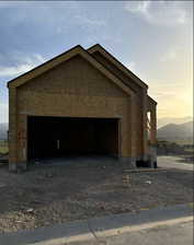 View of garage at dusk