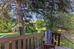 Wooden deck featuring a gazebo