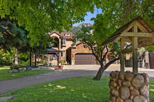 View of front of property featuring a front yard and a gazebo