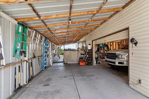 Covered carport part of detached garage/workshop