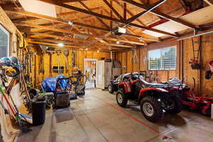 Garage featuring a garage door opener