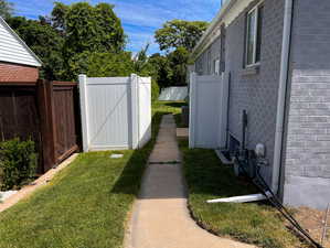 West side of home entering into the backyard