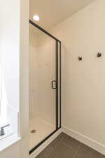 Bathroom with a shower with door