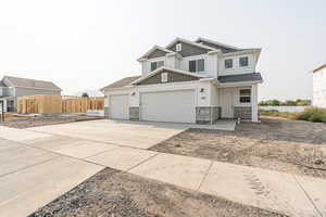 View of front of property featuring a garage