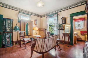 Interior space featuring hardwood / wood-style flooring and a textured ceiling