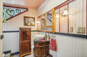 Bathroom featuring tile floors and vanity