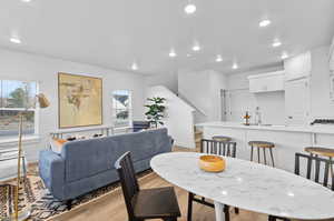 Dining room with sink and light hardwood / wood-style floors