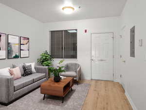 Living room with light hardwood / wood-style flooring