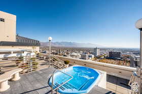 Exterior space featuring a jacuzzi