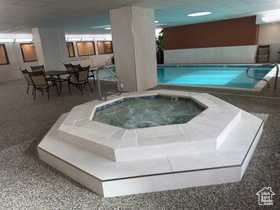 View of pool featuring an indoor hot tub