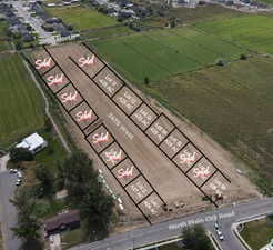 Birds eye view of property with a rural view