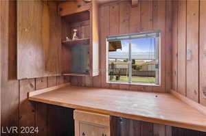 Interior space featuring wood walls and wood counters