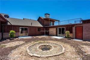 Rear view of property with a patio