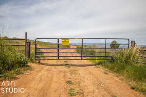 View of gate featuring a rural view