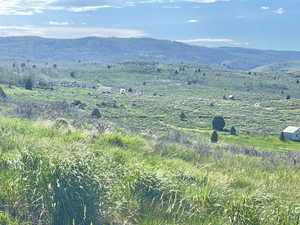 Property view of mountains with a rural view