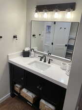 Bathroom featuring hardwood / wood-style floors and vanity