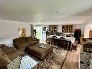 Living room with light wood-type flooring